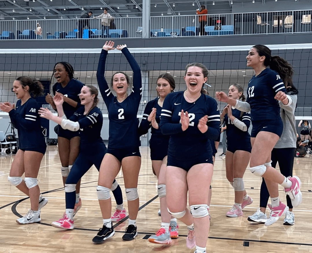 540 volleyball team celebrating