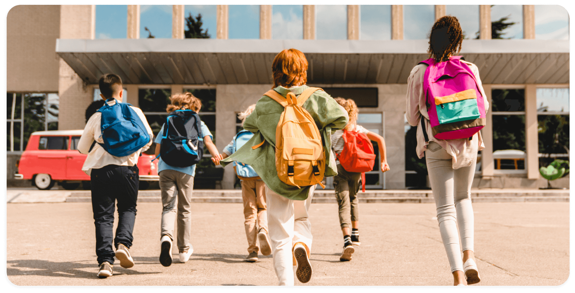 school children with backpacks heading to class