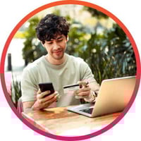 Young man reloading his gift card using his mobile phone