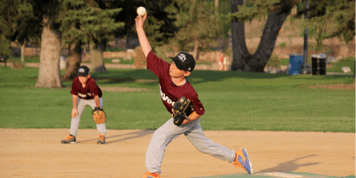 Youth baseball player catching a ball