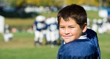 Youth football player in uniform