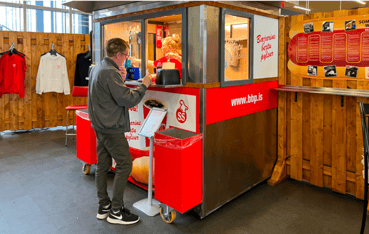 person buying food at a concession stand