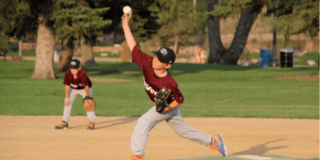 Youth baseball player catching a ball