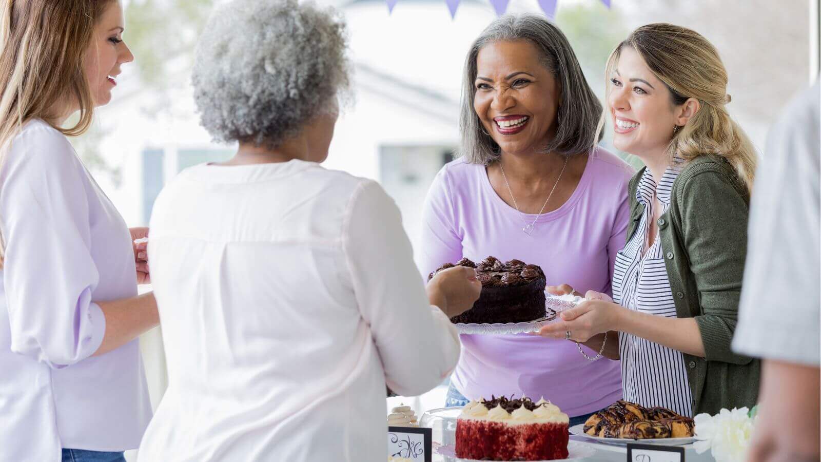 group of women hosting a bake sale fundraiser