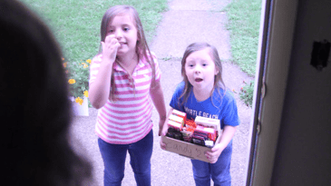 2 girls doing a door to door candy fundraiser