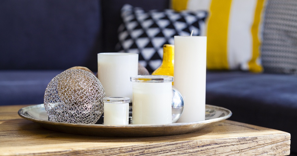 Candles arranged on a coffee table 