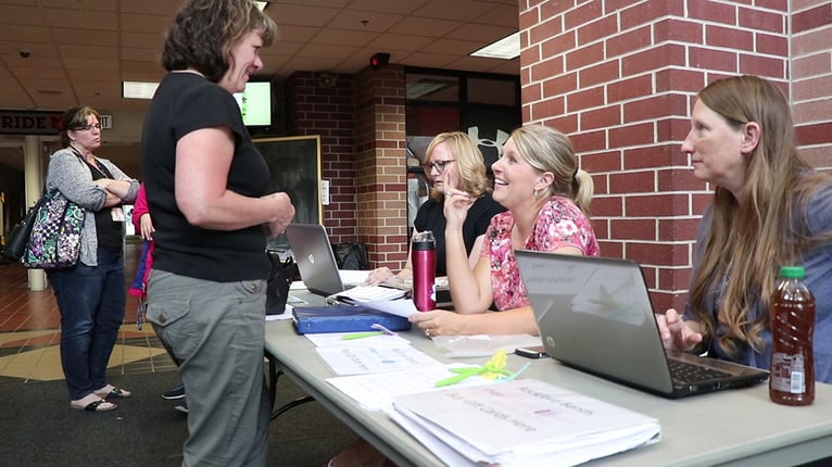 selling_gift_cards_at_scrip_table.jpg