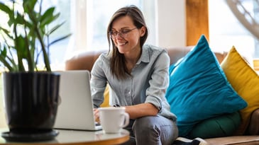 woman doing research about fundraising companies on her laptop at home