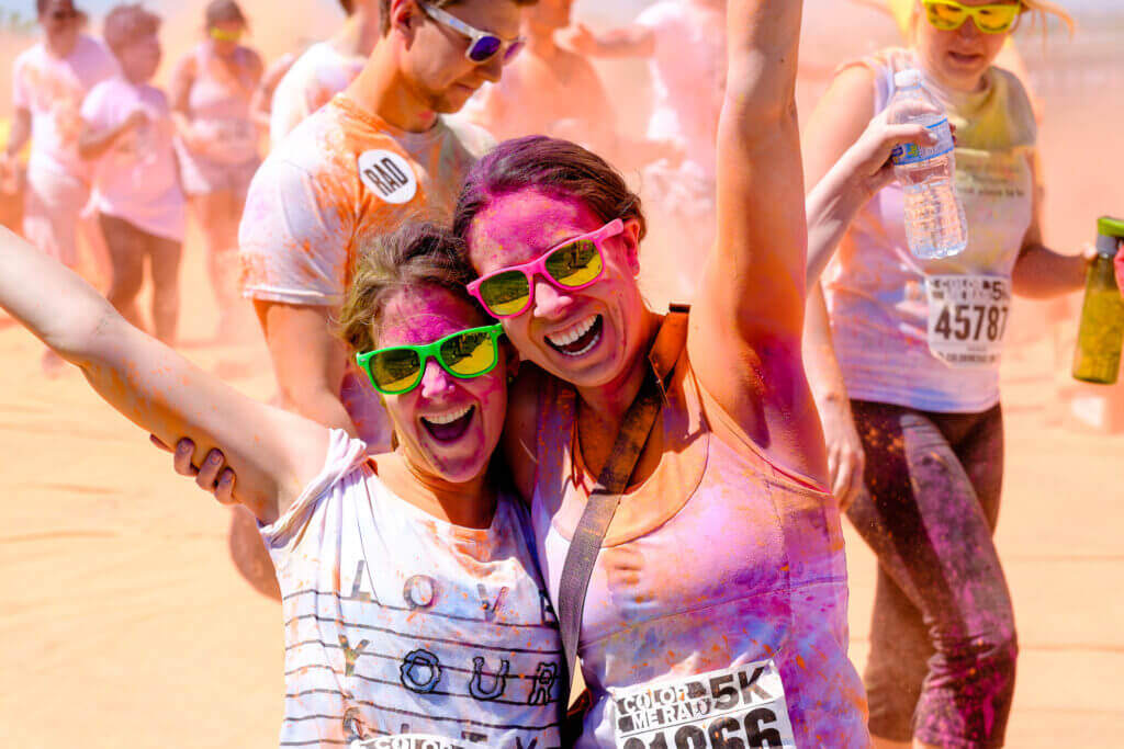 participants celebrating at a color run fundraiser event