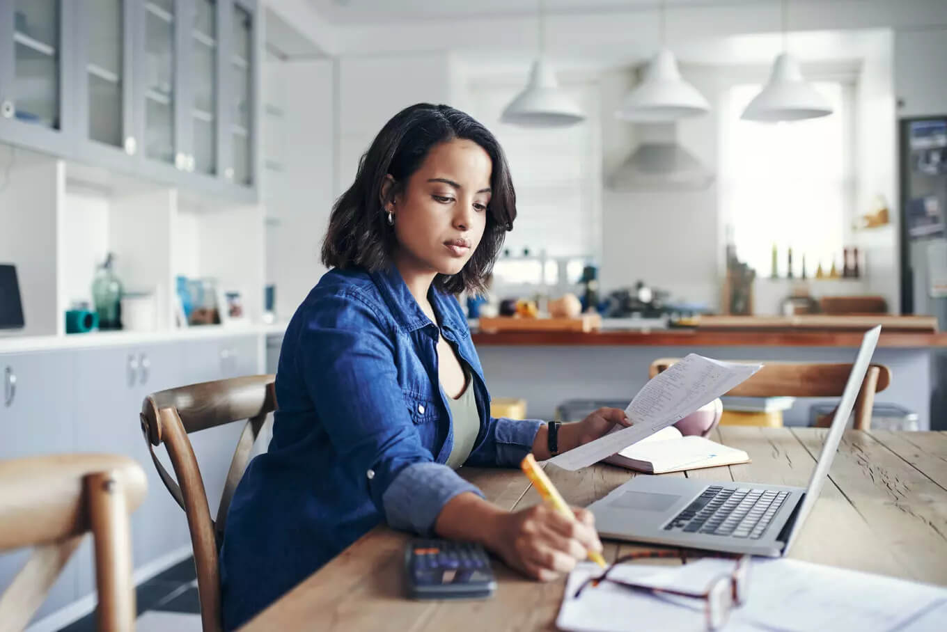 woman working on a fundraising event budget at home