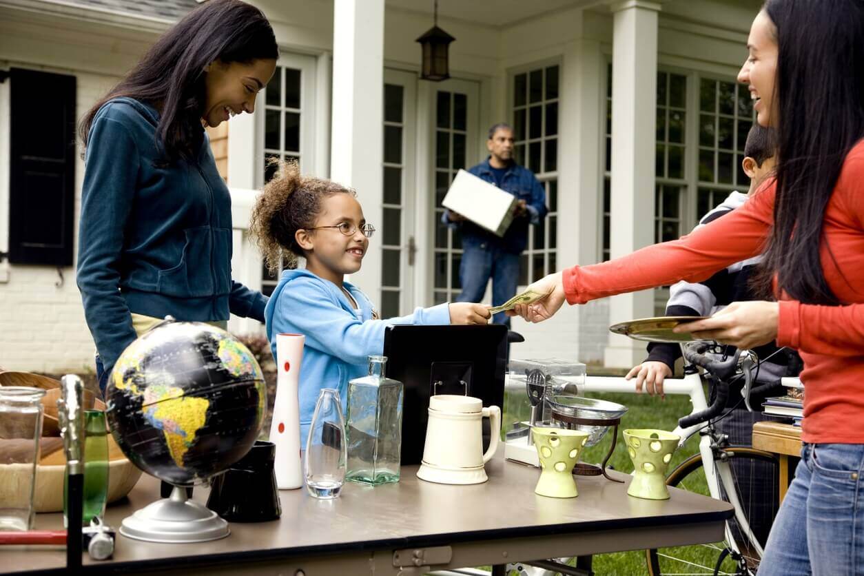 family and customer at garage and yard sale fundraiser