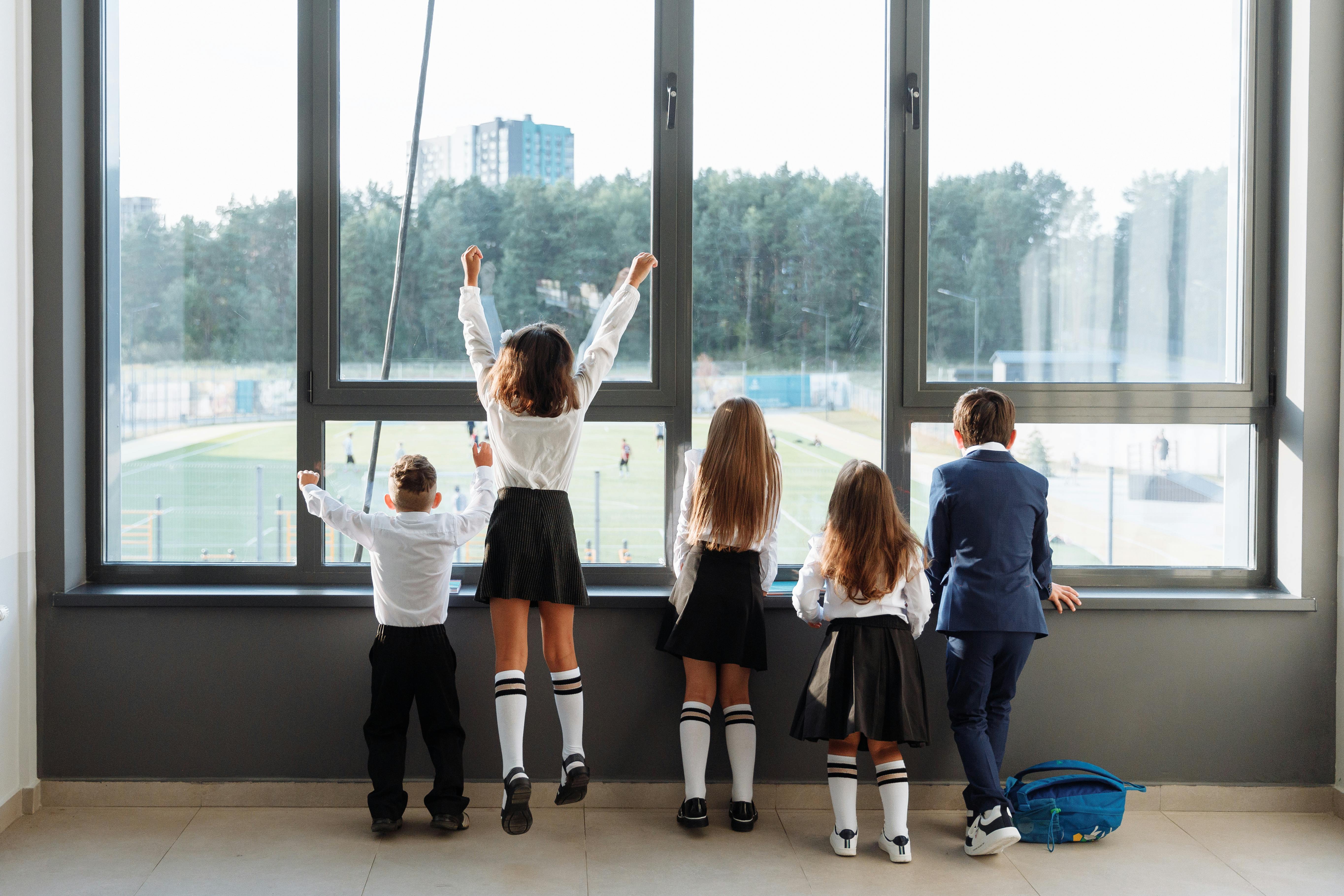 group of private school students looking outside
