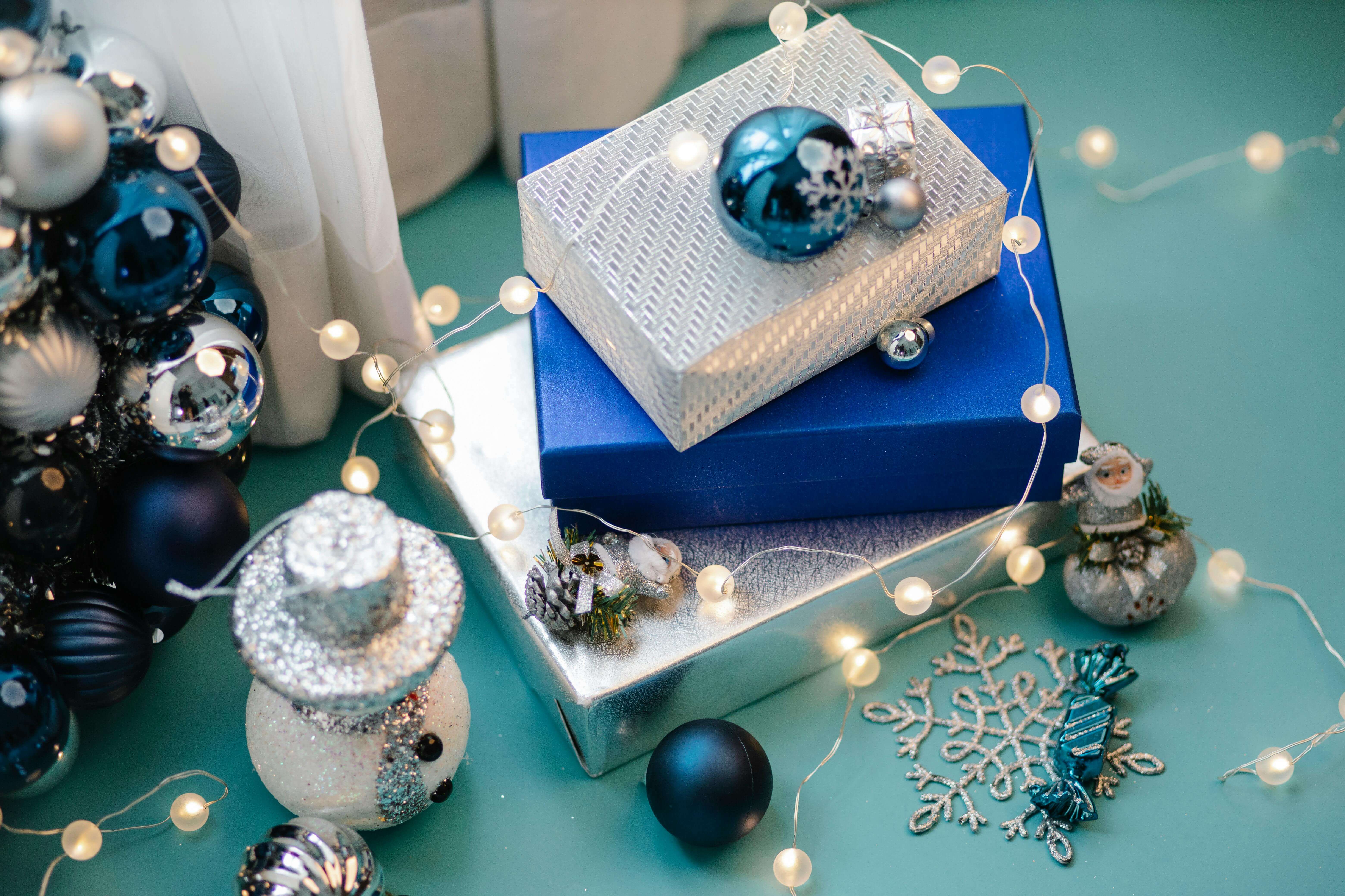 silver and blue gift wrap with holiday decorations