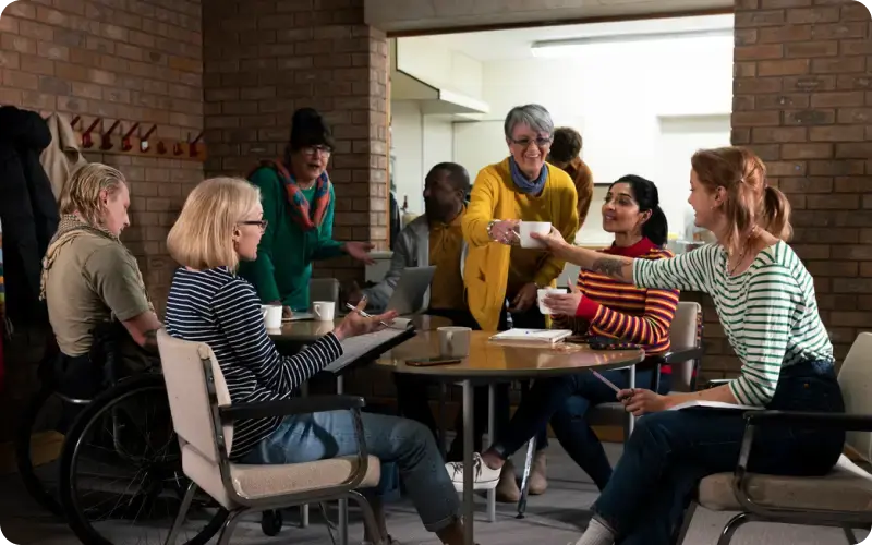 church members having coffee discussing in a meeting