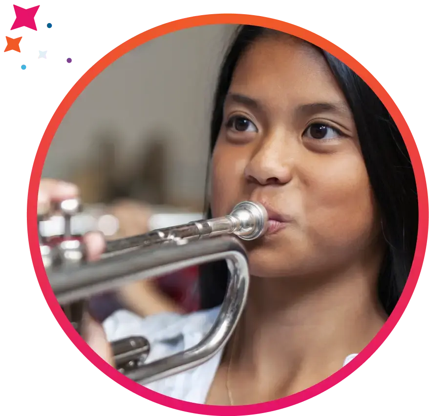 Girl playing trumpet in band practice